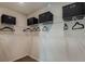 Walk-in closet provides ample storage with shelving units and hanging racks at 3856 King Hill Dr, Haines City, FL 33844