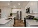 Kitchen with stainless steel appliances, ample counter space, and modern cabinets at 3856 King Hill Dr, Haines City, FL 33844