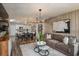 Open-concept living room and dining area with modern decor and ample natural light at 3856 King Hill Dr, Haines City, FL 33844