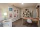 Bright playroom with a desk, shelving, and colorful artwork creating an inspiring space at 3856 King Hill Dr, Haines City, FL 33844