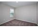 Comfortable bedroom featuring plush carpeting, a window with blinds, and neutral colored walls at 4043 Gardenia Ave, Lake Hamilton, FL 33851