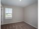 Small bedroom featuring plush carpeting, a window with blinds, and neutral colored walls at 4043 Gardenia Ave, Lake Hamilton, FL 33851