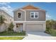 Charming two-story home showcasing its manicured lawn and appealing architectural details at 4043 Gardenia Ave, Lake Hamilton, FL 33851