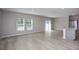 Open-concept living space with light wood floors and natural light provides a welcoming atmosphere at 4043 Gardenia Ave, Lake Hamilton, FL 33851