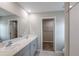 Bright bathroom with double sinks, spacious countertop, and a separate shower area at 4075 Gardenia Ave, Lake Hamilton, FL 33851
