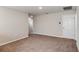 Neutral living room with carpeting and interior doors at 4075 Gardenia Ave, Lake Hamilton, FL 33851