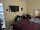 Bedroom with television and open doorway at 617 Vandenberg St, Altamonte Springs, FL 32701