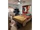 Bedroom featuring a queen-sized bed, three computer monitors, and a fan at 617 Vandenberg St, Altamonte Springs, FL 32701
