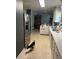 Well-lit kitchen area with a stainless steel refrigerator and ample counter space at 617 Vandenberg St, Altamonte Springs, FL 32701
