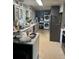 Spacious kitchen with appliances, white cabinetry and an island with seating at 617 Vandenberg St, Altamonte Springs, FL 32701
