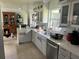 Bright kitchen with white cabinets, stainless steel appliances, and abundant countertop space at 617 Vandenberg St, Altamonte Springs, FL 32701