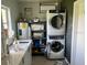Bright laundry room with side-by-side washer and dryer units and plenty of room for storage at 617 Vandenberg St, Altamonte Springs, FL 32701