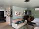 Open living room showcasing a mix of furniture and a convenient mini-split air conditioner at 617 Vandenberg St, Altamonte Springs, FL 32701