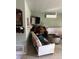 Inviting living area with a blend of furnishings, plus a convenient mini-split air conditioner at 617 Vandenberg St, Altamonte Springs, FL 32701