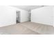 Spacious bedroom featuring neutral carpeting, white walls, and plenty of room for personalization at 13280 Tula Loop, Astatula, FL 34705