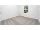 Bedroom with neutral carpet, white walls, and natural light at 13280 Tula Loop, Astatula, FL 34705
