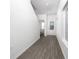 Bright entryway with wood-style flooring, white walls, stairway, and a decorative glass front door at 13280 Tula Loop, Astatula, FL 34705