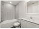 Bright bathroom features a shower-tub combo, a modern vanity, and new fixtures at 1794 White Elephant Loop, Winter Haven, FL 33884