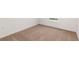 Neutral bedroom has light carpet and a window with a view of the lawn at 1794 White Elephant Loop, Winter Haven, FL 33884