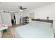 Well-lit bedroom with neutral color palette, closet, and plenty of storage space at 2937 Delrose N Dr, Lakeland, FL 33805