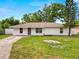 Charming single-story home features a well-manicured lawn and inviting front entrance at 2937 Delrose N Dr, Lakeland, FL 33805
