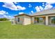 Spacious backyard with green grass, perfect for outdoor activities and entertaining at 3183 Seville St, Lake Alfred, FL 33850