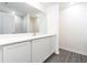 Bathroom featuring white cabinets, stone countertops, undermount sink, and full vanity mirror at 3183 Seville St, Lake Alfred, FL 33850