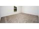 Cozy bedroom with neutral carpeting and a window, offering natural light at 3183 Seville St, Lake Alfred, FL 33850
