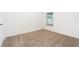 Carpeted bedroom with window providing natural light, ideal for a cozy atmosphere at 3183 Seville St, Lake Alfred, FL 33850