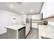 Well-lit kitchen featuring granite countertops, stainless steel appliances and island at 3183 Seville St, Lake Alfred, FL 33850