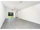 Spacious living room featuring sliding glass doors that let in natural light at 3183 Seville St, Lake Alfred, FL 33850