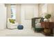 Charming Bedroom with crib, comfortable chair, natural light, and stylish decorative elements at 3443 Howell Dr, Lake Wales, FL 33859