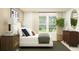 Bright bedroom with a large window, stylish furnishings, and ample natural light at 3443 Howell Dr, Lake Wales, FL 33859