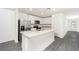 Modern kitchen featuring stainless steel appliances, granite countertops, and a center island at 3736 Bergamot St, Lake Alfred, FL 33850
