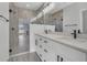 Modern bathroom featuring a double vanity with modern fixtures and a glass-enclosed shower at 12921 Sw 64Th Terr Rd, Ocala, FL 34473