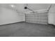 Large garage with epoxy floor coating and an automatic garage door opener at 12921 Sw 64Th Terr Rd, Ocala, FL 34473