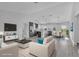 Open-concept living space with modern furniture, TV, and a dining area with seating for four at 12921 Sw 64Th Terr Rd, Ocala, FL 34473