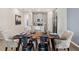 Stylish dining area with an open-concept design flowing into the modern kitchen at 2008 Rider Rain Ln, Apopka, FL 32703