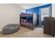 bedroom with a bunk bed and blue accent wall at 321 Auburn Ave, Kissimmee, FL 34747
