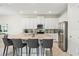 Spacious kitchen with a large island, seating, and modern stainless steel appliances, perfect for entertaining and cooking at 321 Auburn Ave, Kissimmee, FL 34747