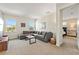 Cozy living room with a comfortable sectional sofa and view into the bedroom at 321 Auburn Ave, Kissimmee, FL 34747