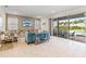 Living room with sliding glass doors that lead to a pool area at 321 Auburn Ave, Kissimmee, FL 34747
