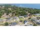 An aerial view of many homes in a neighborhood with mature tree coverage near the lake at 5144 Riverlake Dr, Bartow, FL 33830