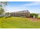 A spacious backyard featuring a screened enclosure with a well-maintained lawn at 5144 Riverlake Dr, Bartow, FL 33830