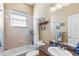 Bathroom with shower and tub combo, single vanity, and neutral colors at 5144 Riverlake Dr, Bartow, FL 33830