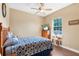 Bedroom with hardwood floors, ceiling fan, and ample natural light at 5144 Riverlake Dr, Bartow, FL 33830
