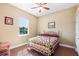 Bedroom with hardwood floors, ceiling fan, and ample natural light at 5144 Riverlake Dr, Bartow, FL 33830