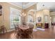 An elegant dining room featuring wood floors and architectural columns at 5144 Riverlake Dr, Bartow, FL 33830