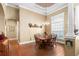Dining room with wood floors, large window and decorative chandelier at 5144 Riverlake Dr, Bartow, FL 33830