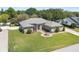Well-manicured front lawn and charming home exterior with inviting curb appeal at 5144 Riverlake Dr, Bartow, FL 33830
